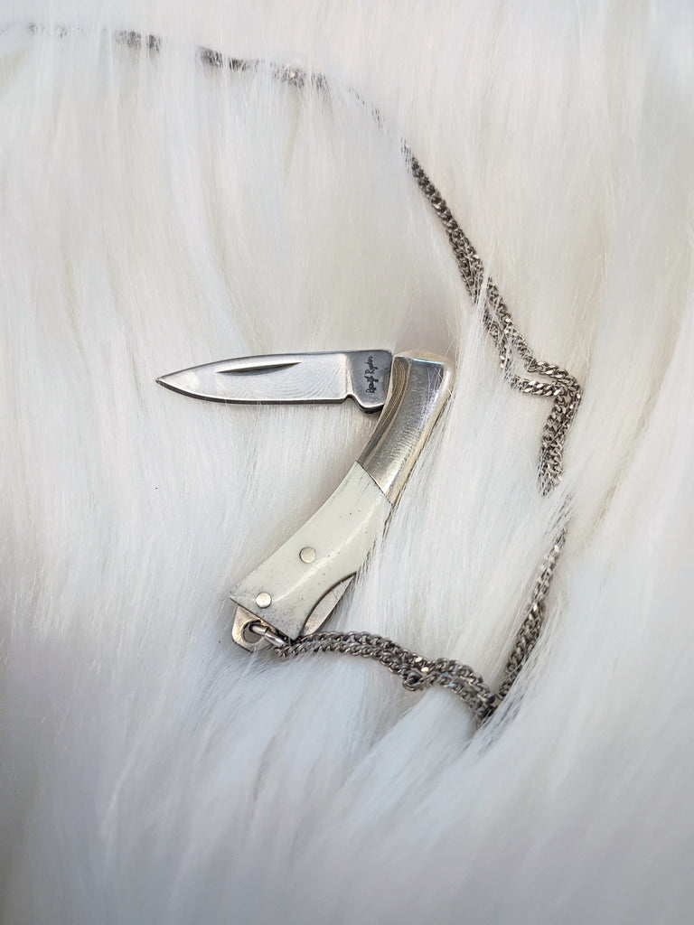Curvilinear Bone Lockback Knife Necklace
